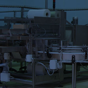 Shrink wrapping machines